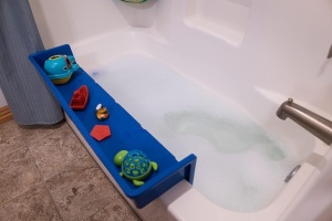 Tub Topper® Bathtub Splash Guard Play Shelf Area -Toy Tray Caddy Holder Storage -Suction Cups Attach to Bath Tub -No Mess Water Spill in Bathroom -Fun for Toddlers Kids Baby 36 x 9 x 9.5 inches 