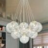 RRTYO&nbsp;Bolton 13-Light Modern Brushed Brass Sputnik Cluster Clear Swirled Glass Globe Bubble Chandelier