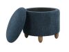 OSP Home Furnishings Lyra Storage Ottoman in Indigo Fabric with Medium Oak Legs