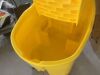 Rubbermaid Commercial Products WaveBrake 35 Qt. Plastic Mop Bucket with Wringer - 4