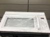 White Microwave Hood Combination. Appears New With Dent on Side. Tested