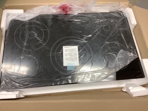 LG 36 in. Cooktop in Black with 5 Elements, SmoothTouch Controls and Warming Zone, Retail: $1,299, Appears New, Sold as is