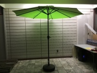 Lime Green Patio Umbrella & Base w/ Crank/Tilt Feature. Tested/Works. Appears New.&nbsp;
